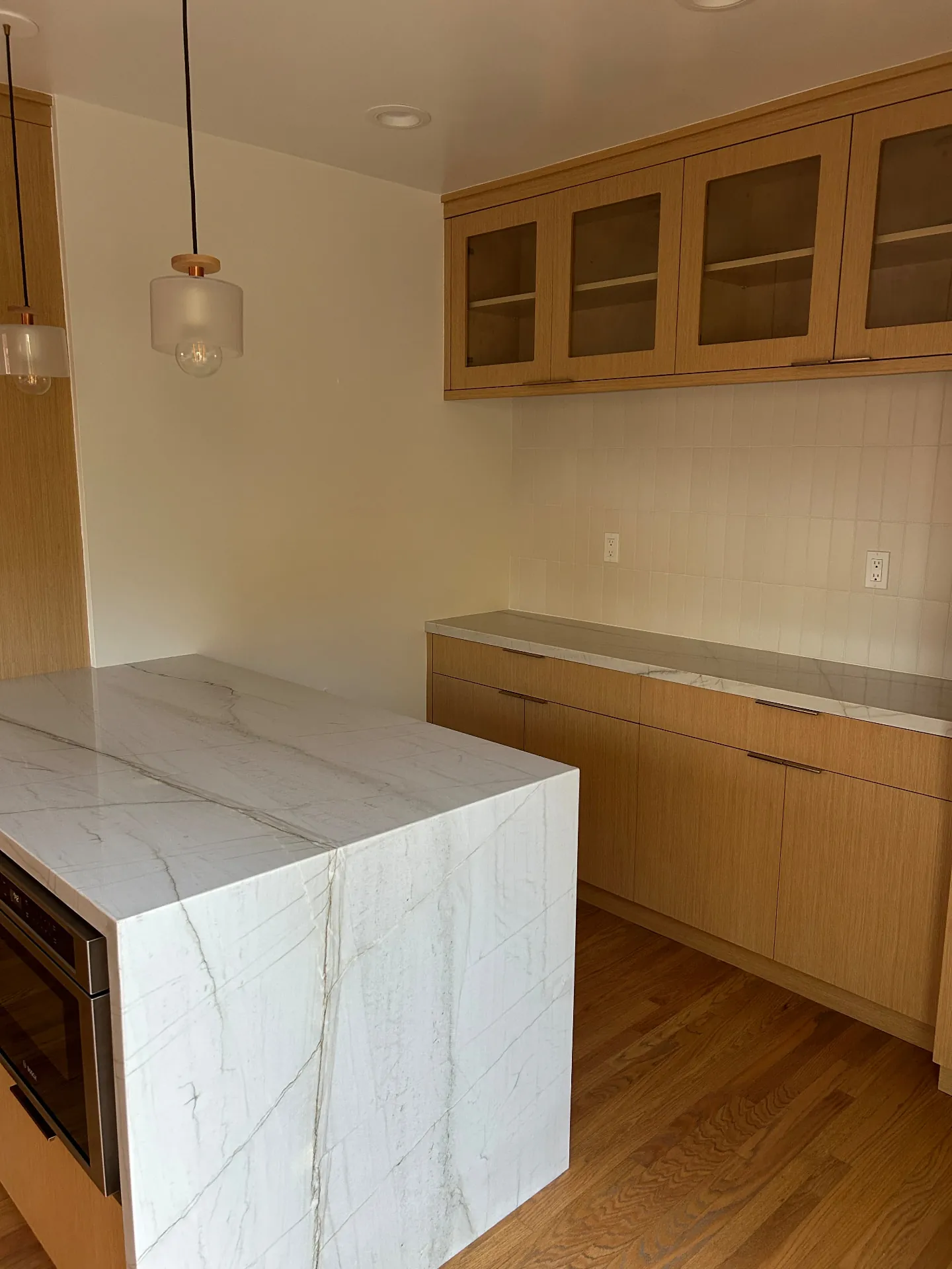San Roque pantry area with painted walls, ceiling and glass-front cabinets