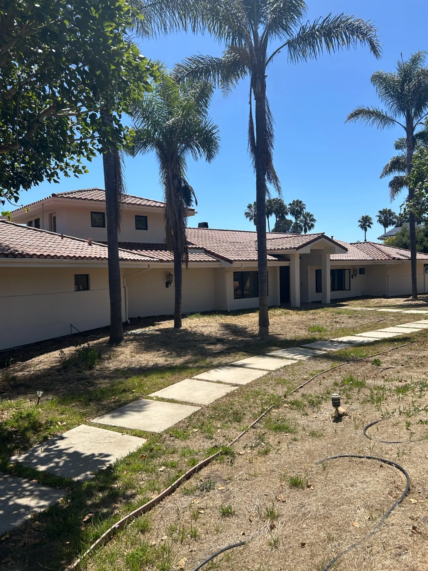 Rear courtyard view of the repainted estate
