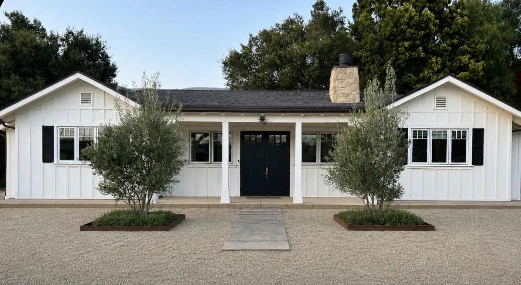 Freshly painted white Craftsman home in Santa Barbara with black door and shutters